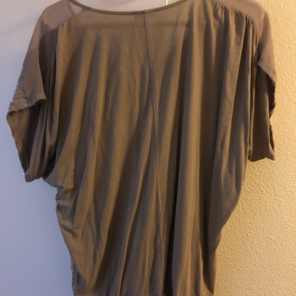 Tan sequined top.
